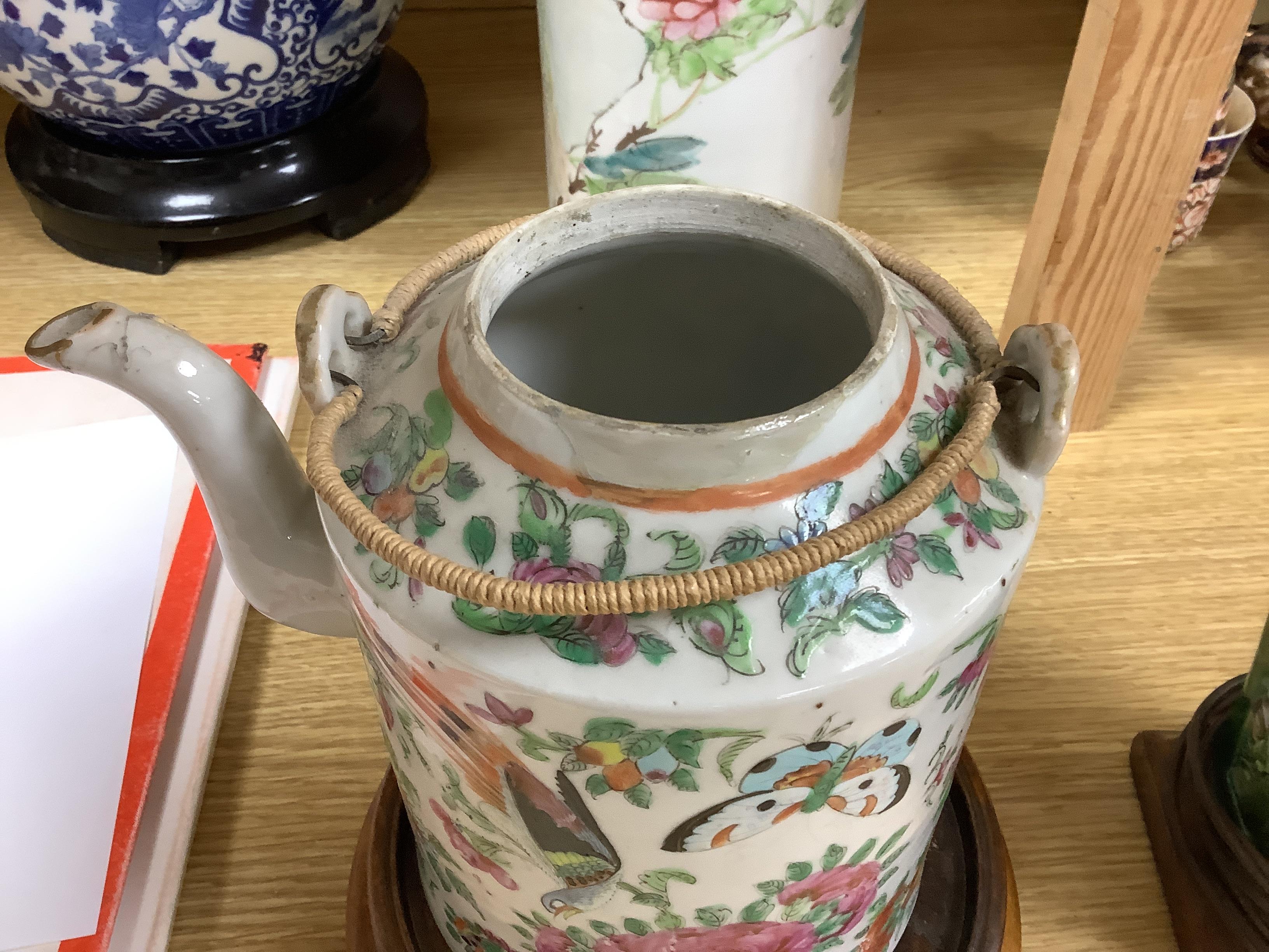 A Chinese famille rose inscribed hat stand and teapot and cover, both late 19th/early 20th century (2) tallest 29cm